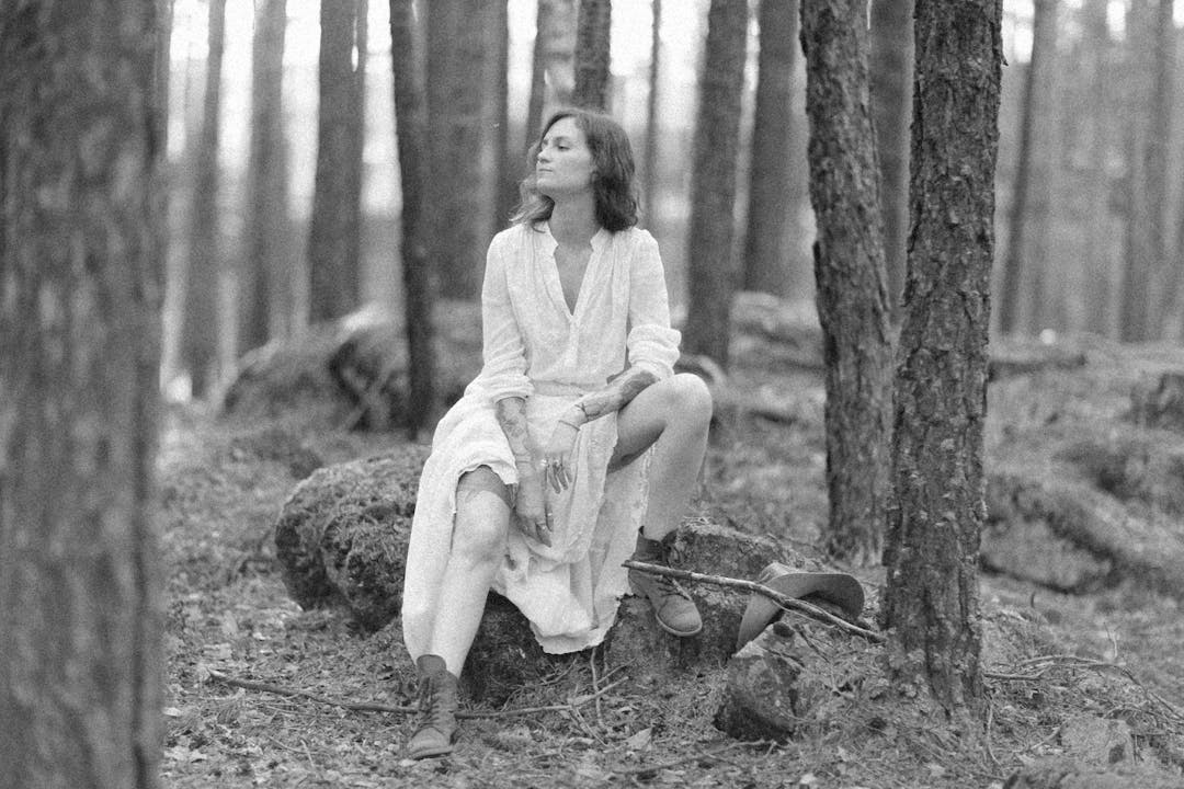 Individual in peaceful moment appearing relieved and content