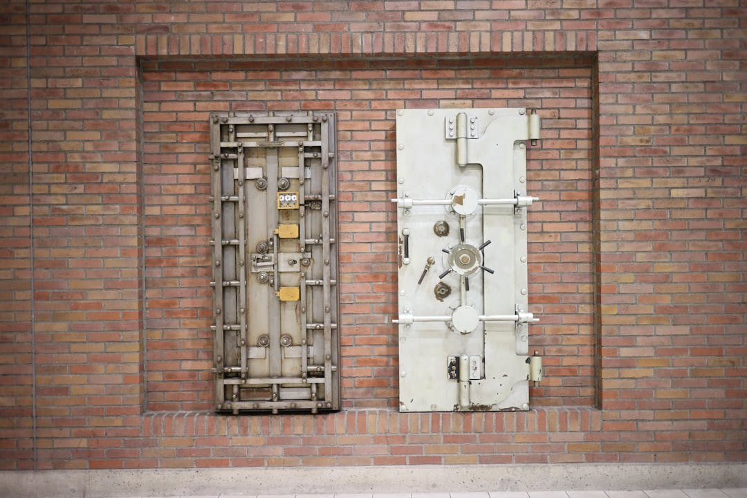 Heavy bank vault door with combination lock representing security