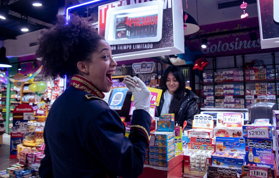 Retail store interior with products displayed and customer shopping