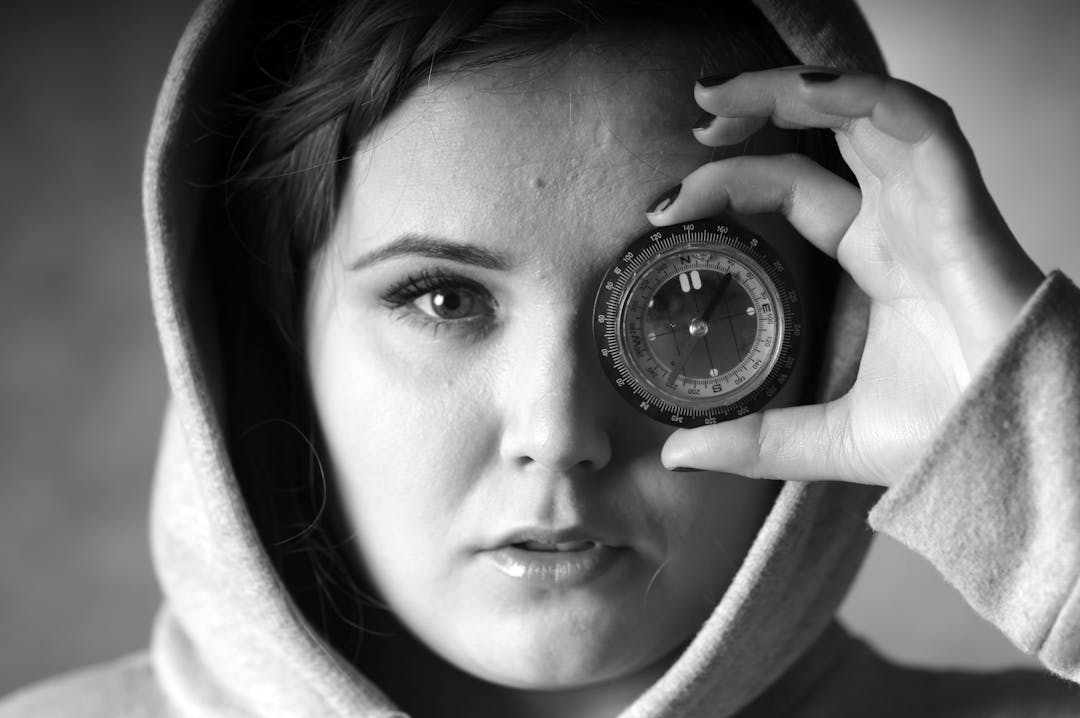 Vintage brass compass pointing true north representing actionable guidance for deal navigation