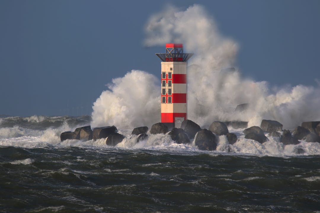 Lighthouse beam cutting through fog