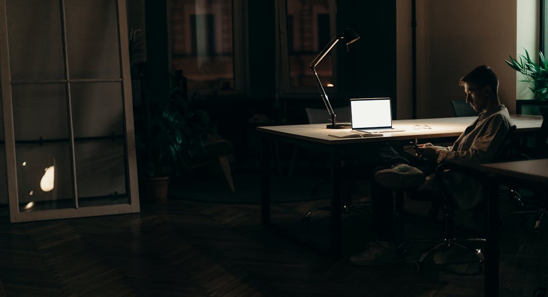 Business owner working solitary at desk, representing business identity and purpose