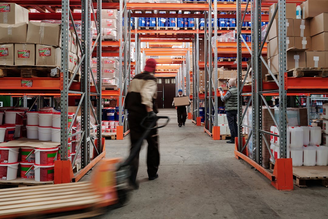 Warehouse shelving with organized inventory and stock management systems