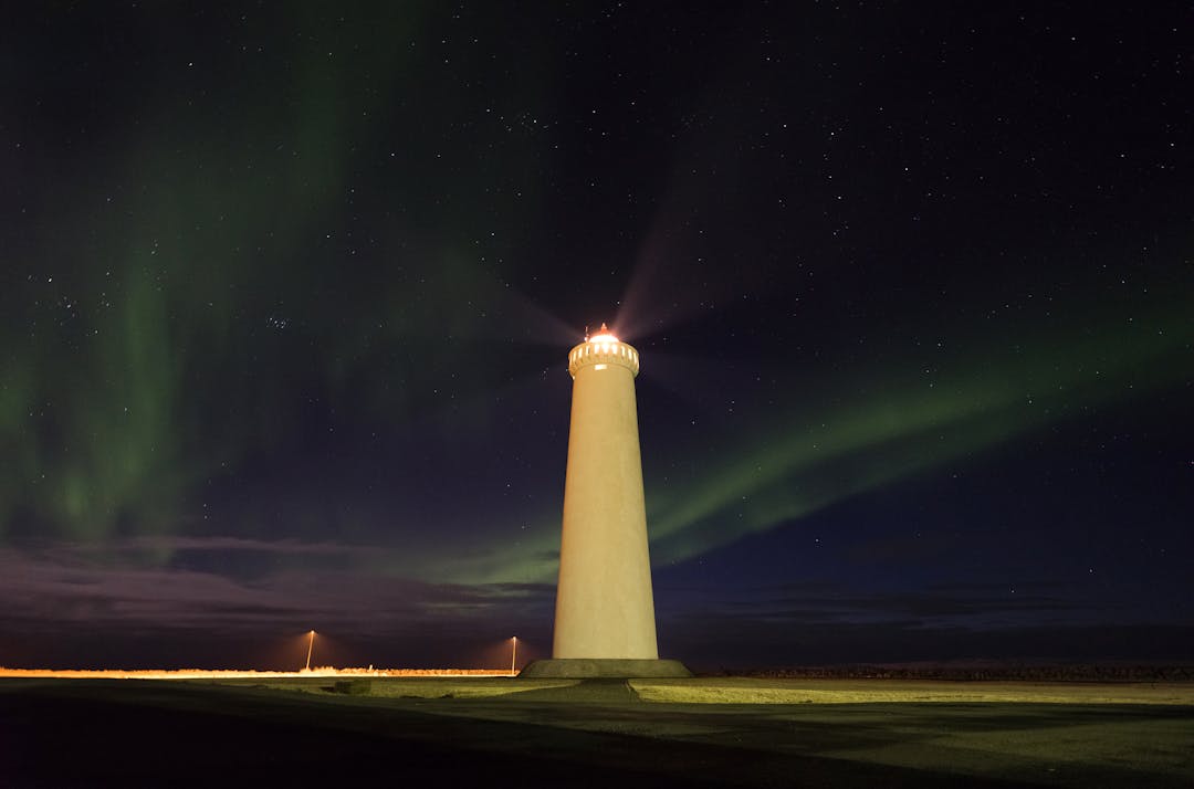Lighthouse beam cutting through fog to guide ships representing actionable guidance for negotiations