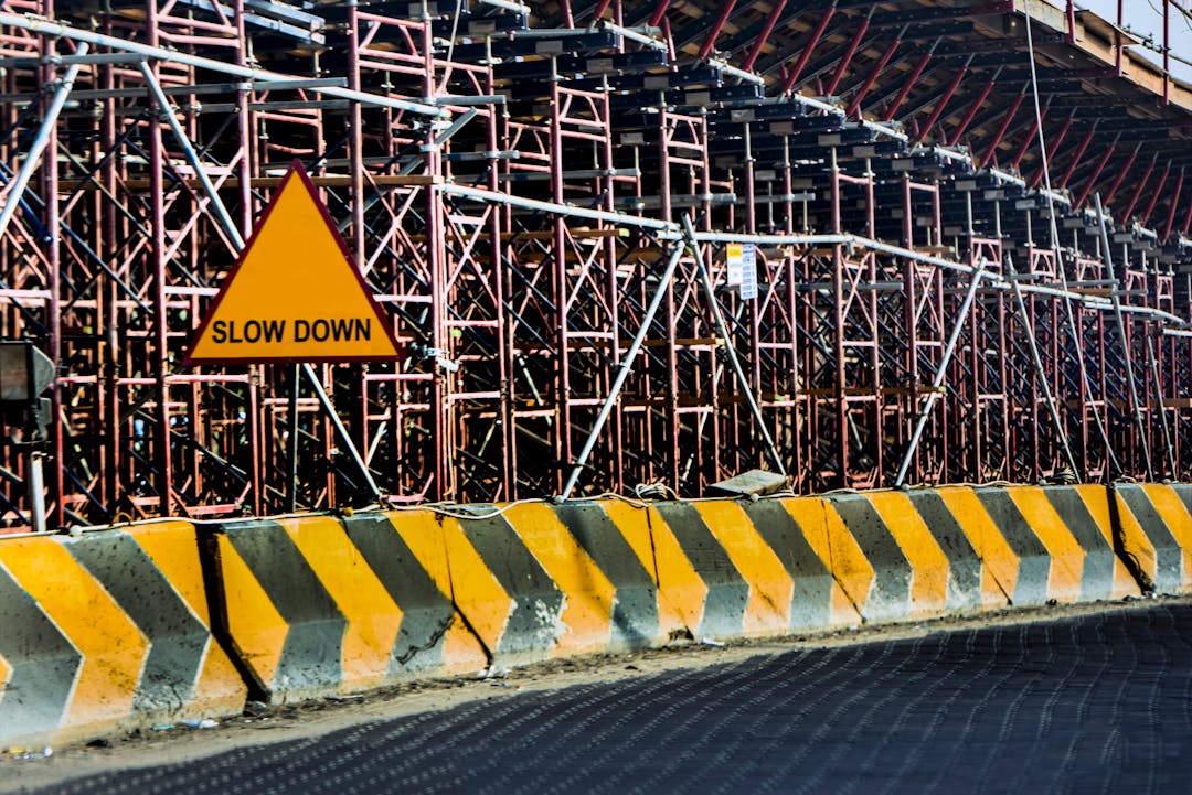 Construction barriers representing implementation risks and challenges requiring careful navigation