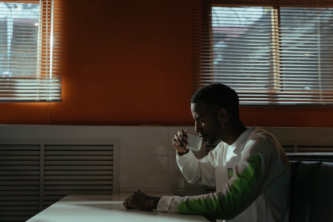 Person gazing out window in quiet moment of reflection and contemplation