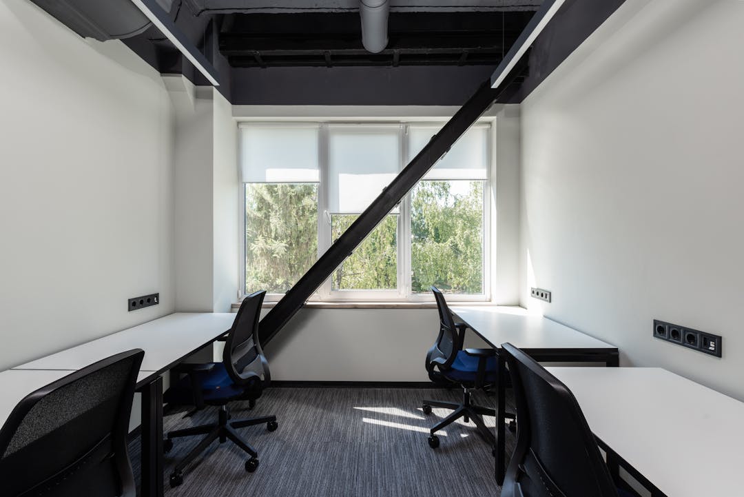 Empty conference room with documents and chairs prepared for important business negotiations