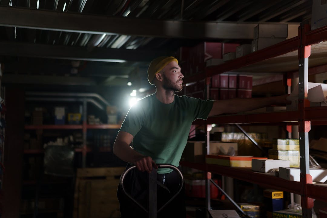 Two professionals walking through manufacturing facility reviewing operations and infrastructure conditions