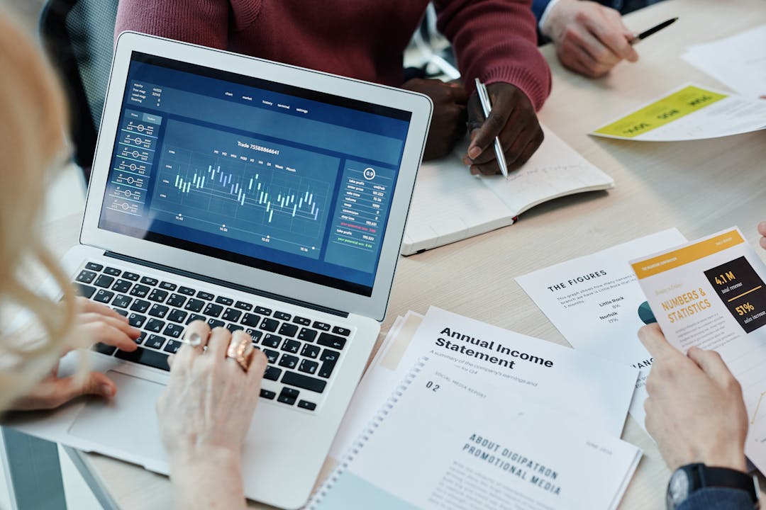 Business professionals reviewing strategic documents and planning materials on desk