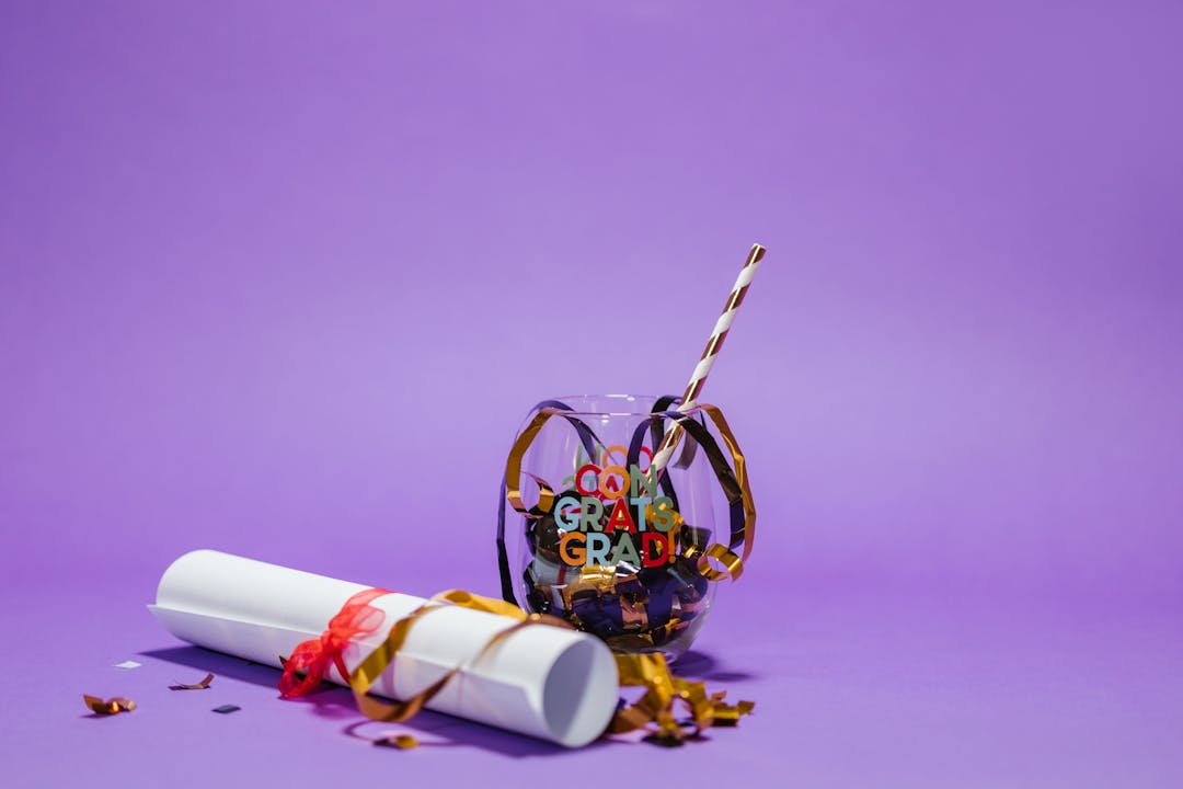 Person standing on mountain peak at sunrise representing successful long-term investment