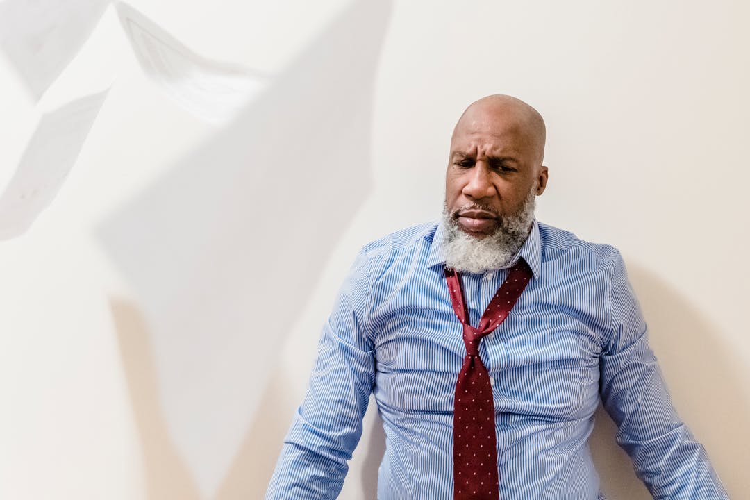 Anxious business owner reviewing documents with furrowed brow