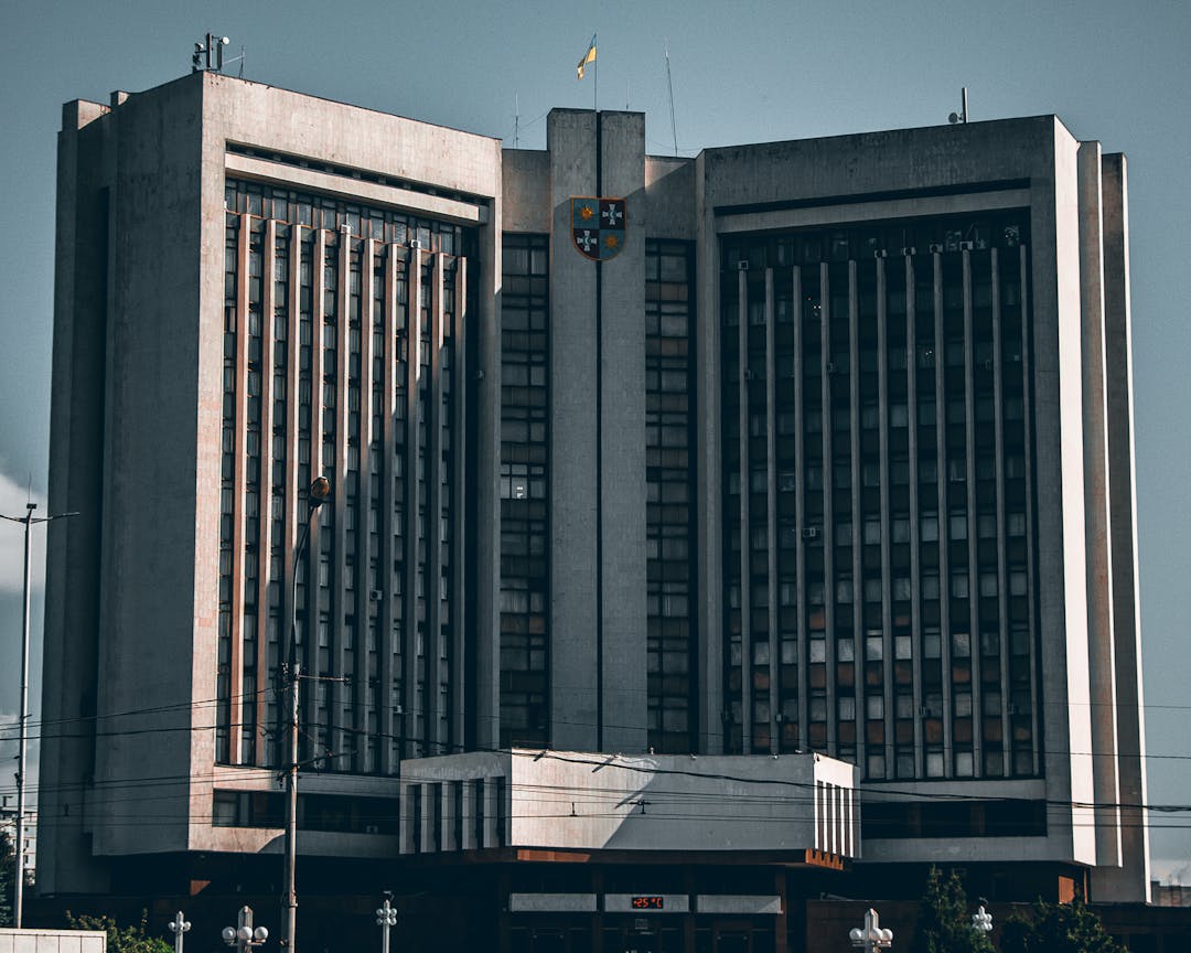 Federal building facade representing regulatory oversight and government compliance requirements