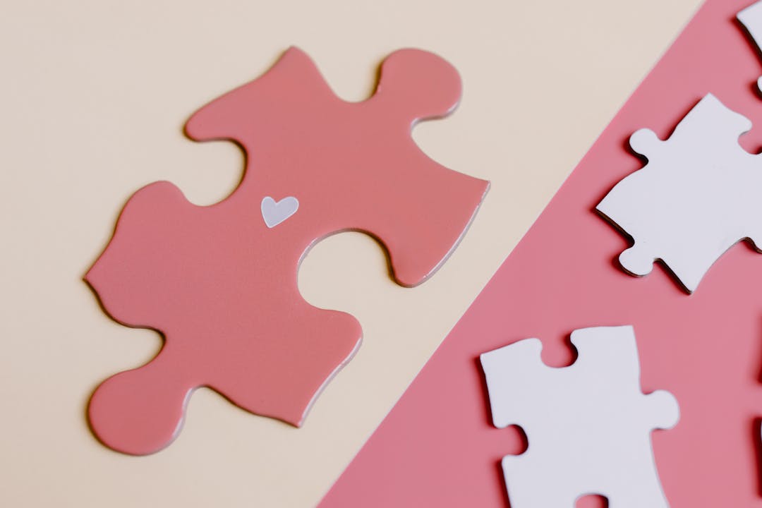 Interlocking puzzle pieces fitting together, representing strategic buyer synergies