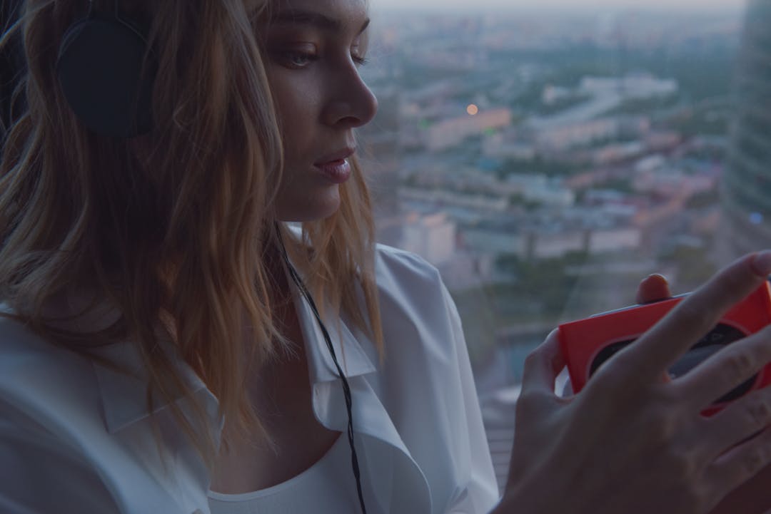 Mountain peak with narrow window opening showing distant valley representing timing opportunities