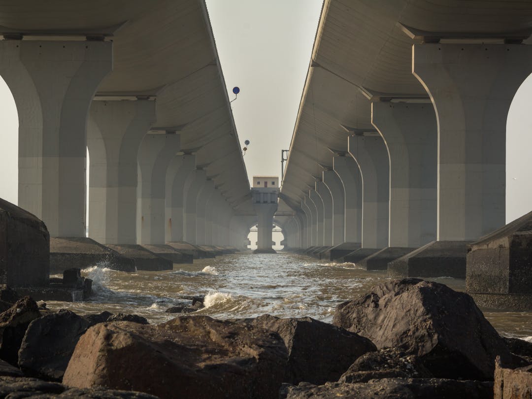 Strong bridge crossing rough waters symbolizing business continuity during challenging times