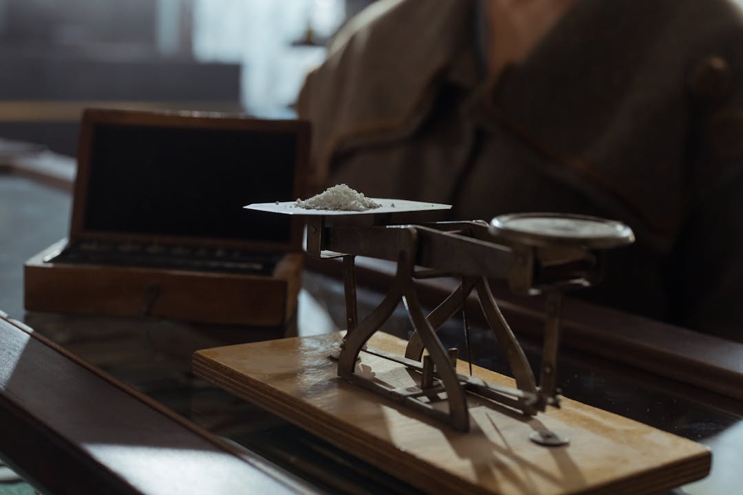 Traditional brass balance scales with different weights representing risk assessment and decision making