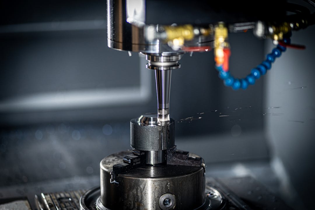 Detailed view of precision CNC machining equipment showing operational wear patterns