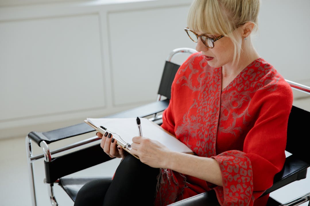 Team reviewing presentation recording receiving constructive feedback for improvement