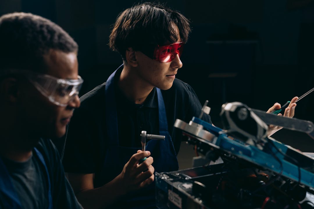 Skilled technician examining complex machinery demonstrating technical expertise and tribal knowledge