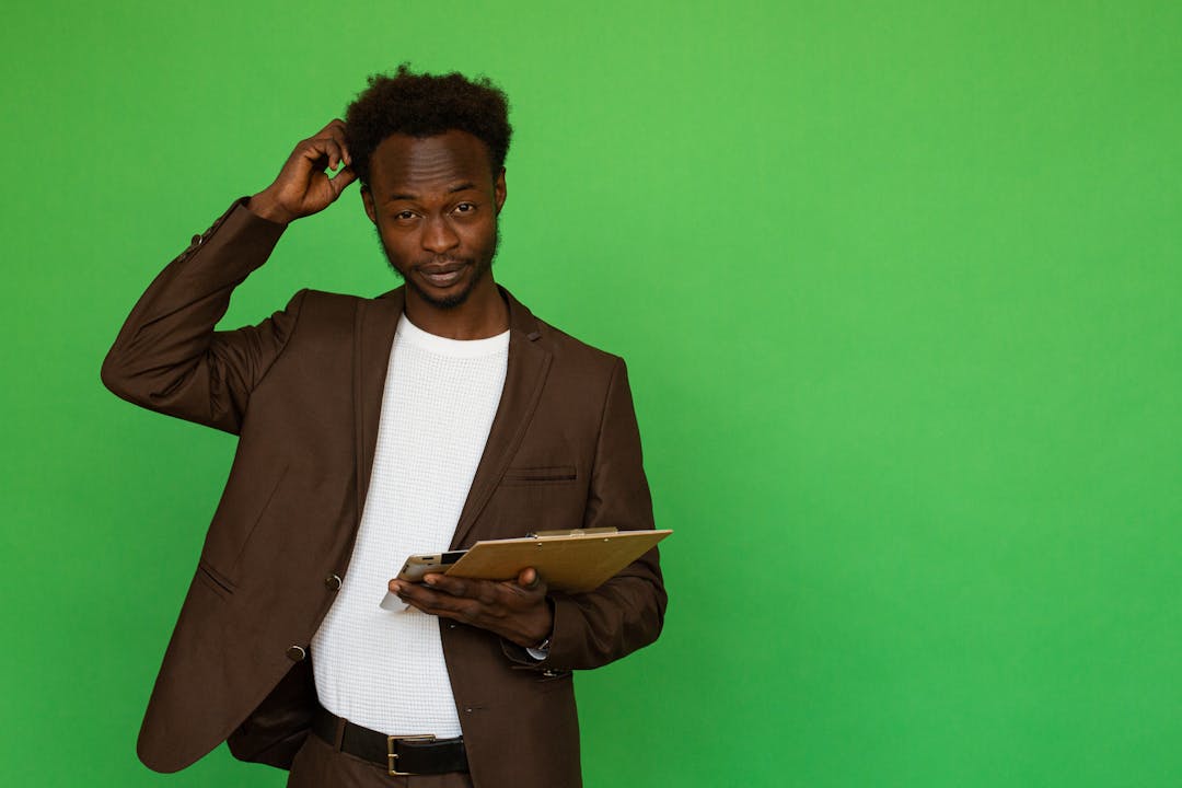 Business owner looking thoughtfully at documents, representing the weight of seller financing decisions