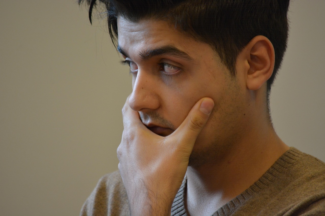 Manager listening carefully to employee feedback with open body language and focused attention