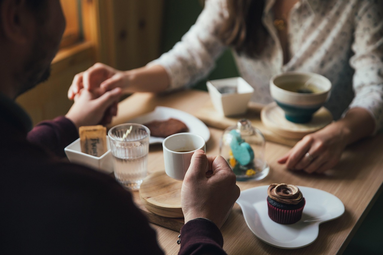 Two professionals talking over coffee