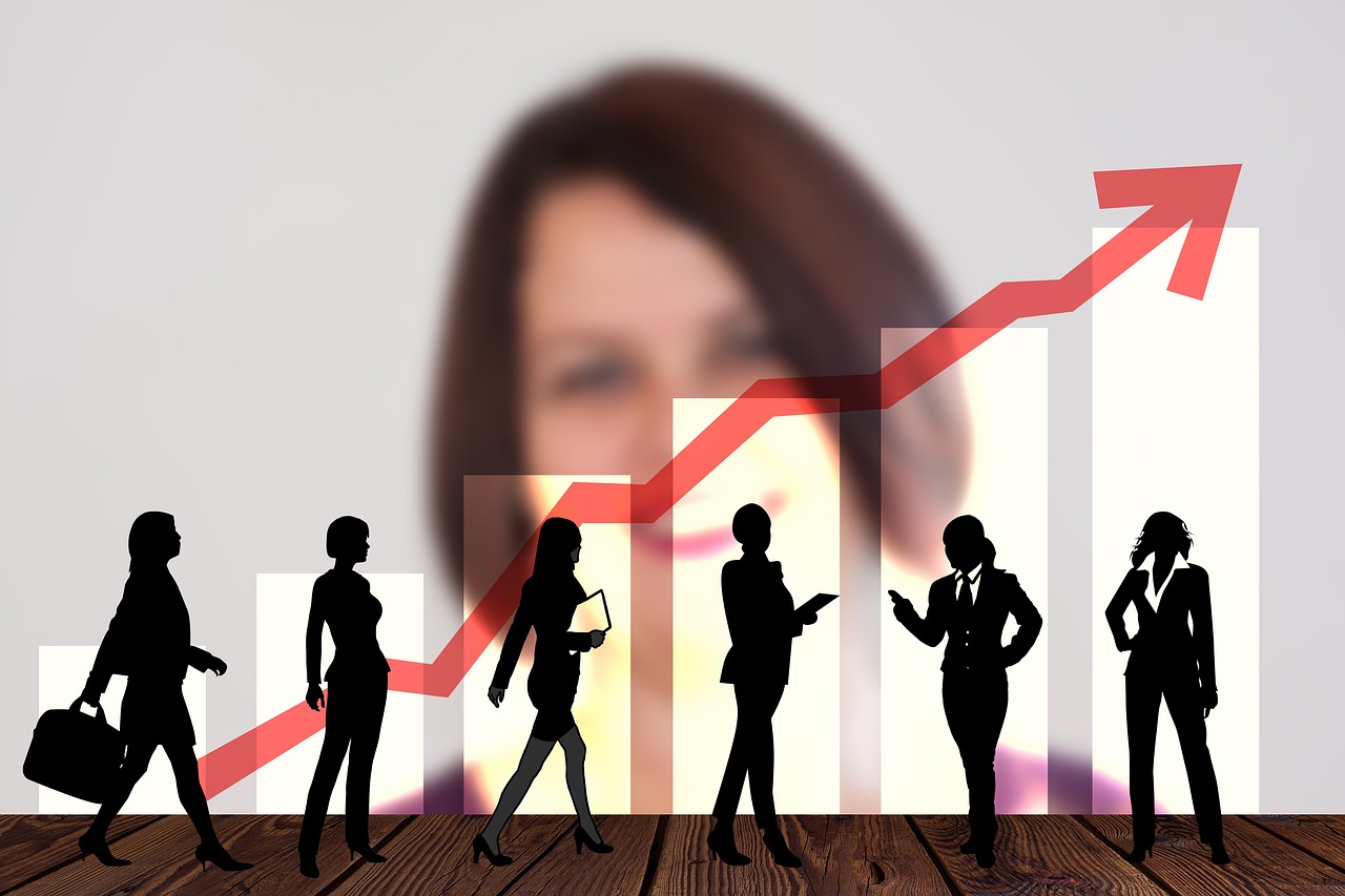 Experienced professional observing and listening to team exchange without dominating