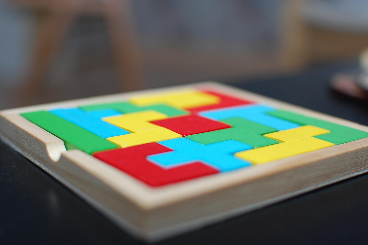 Final puzzle piece being placed to complete a larger picture