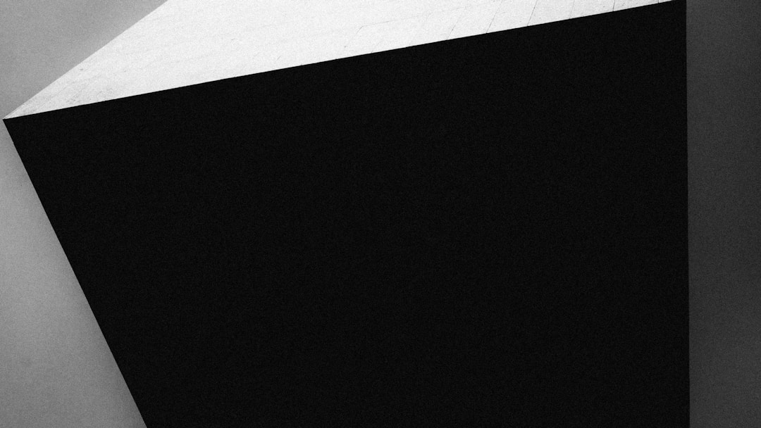 Professional closing moment with executed agreement and handshake