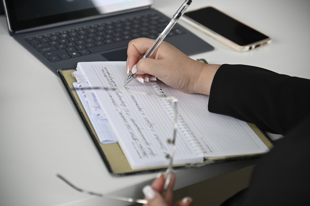 Close-up of accountant examining financial documents and spreadsheets with focused intensity