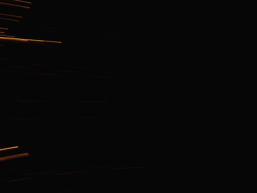 Professional team members engaged in collaborative discussion around conference table