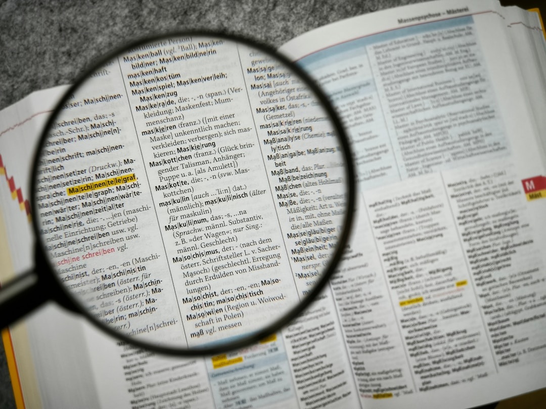 Magnifying glass revealing hidden details in business contract fine print analysis