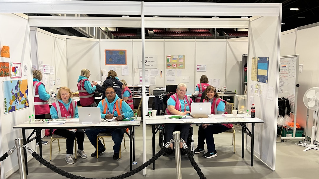 Diverse warehouse team collaborating on inventory management during busy period