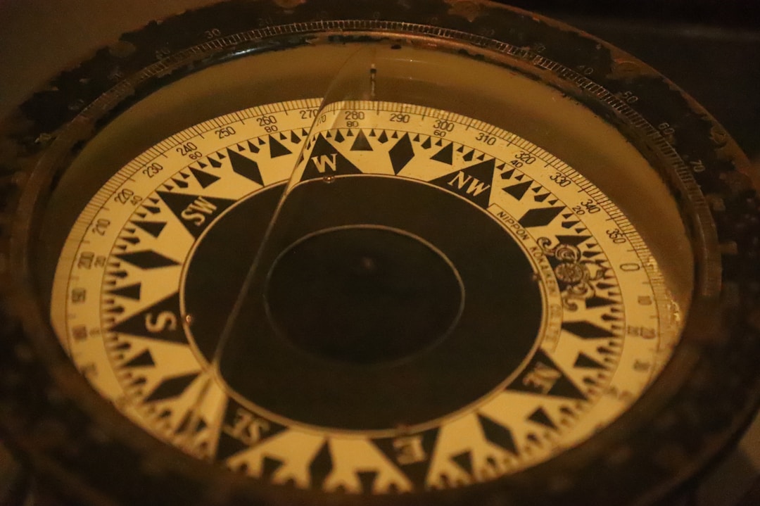 Close-up of vintage compass showing navigation and direction-finding concepts
