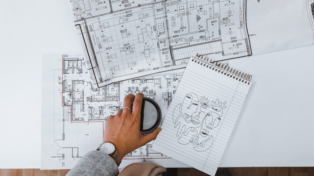 Detailed architectural blueprints with measuring tools for precise construction planning