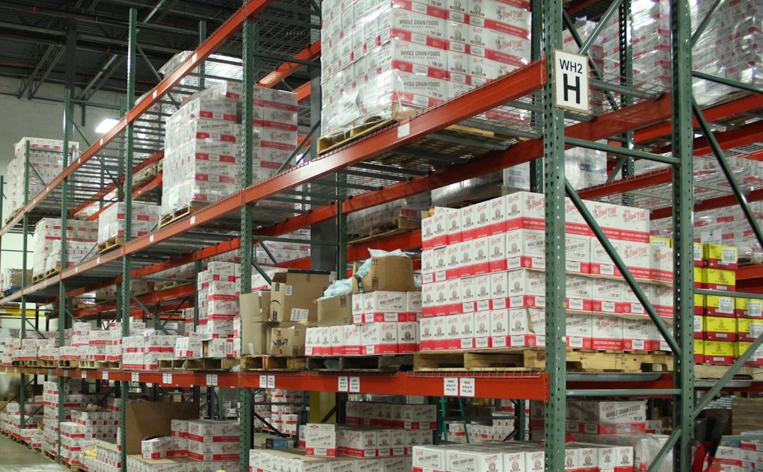 Organized warehouse shelving with inventory boxes and stock management in distribution operation