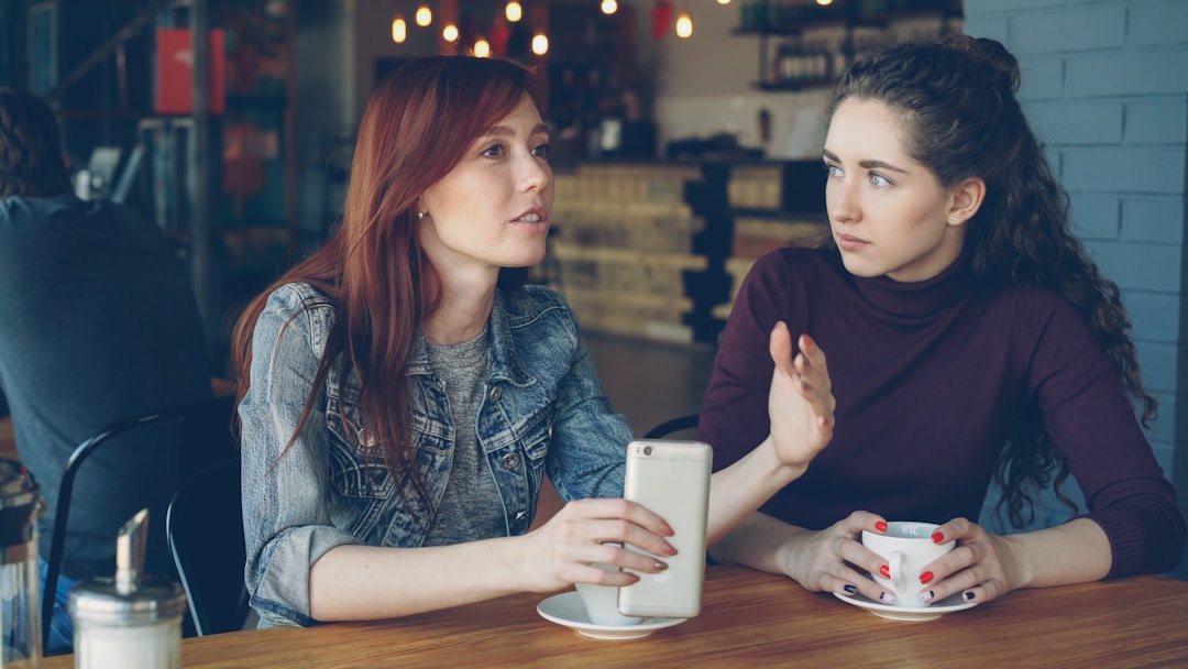 Two people in genuine conversation showing openness and authentic human connection