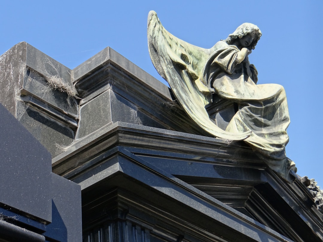 Determined climber approaching mountain peak symbolizing successful outcome achievement