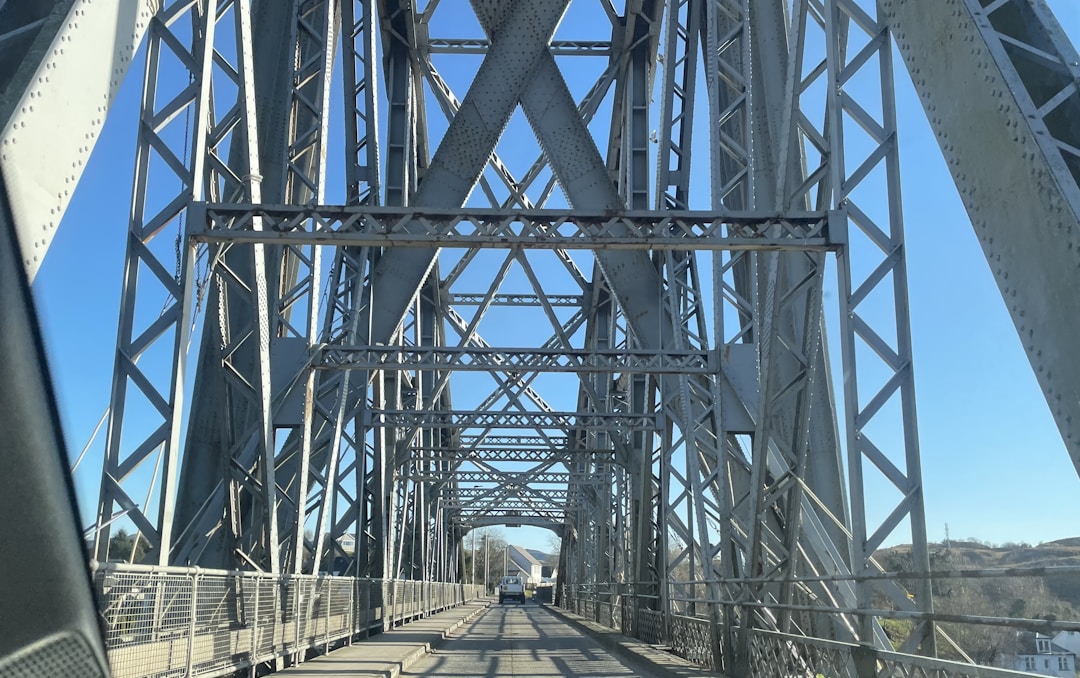 Wooden bridge spanning gap between cliffs symbolizing reconnection with dormant partners