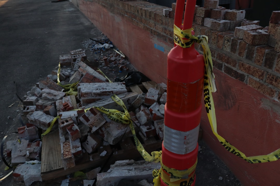 Bright yellow caution tape blocking access to construction or restricted work area