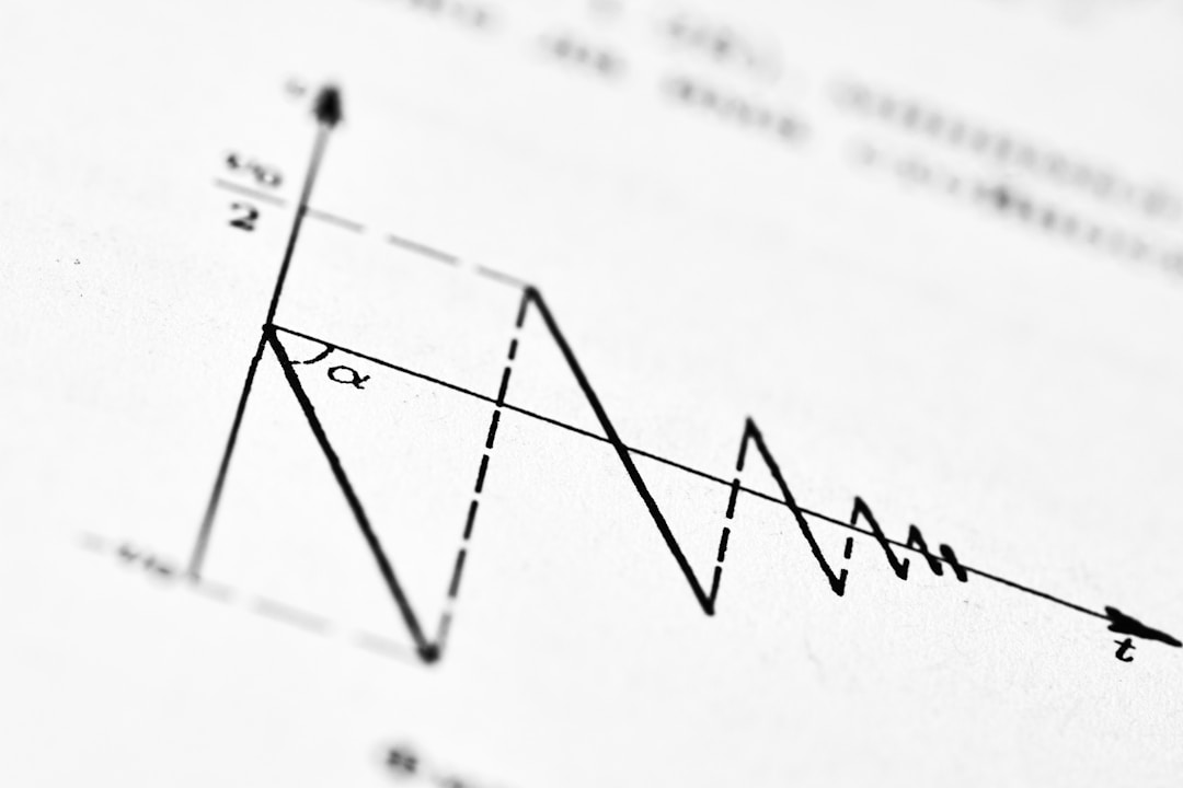 Person examining downward trending charts and performance metrics on screen