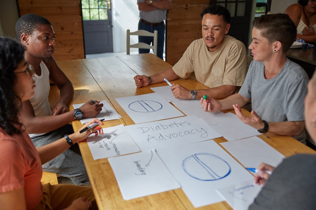 Team members collaborating around whiteboard with strategic planning notes