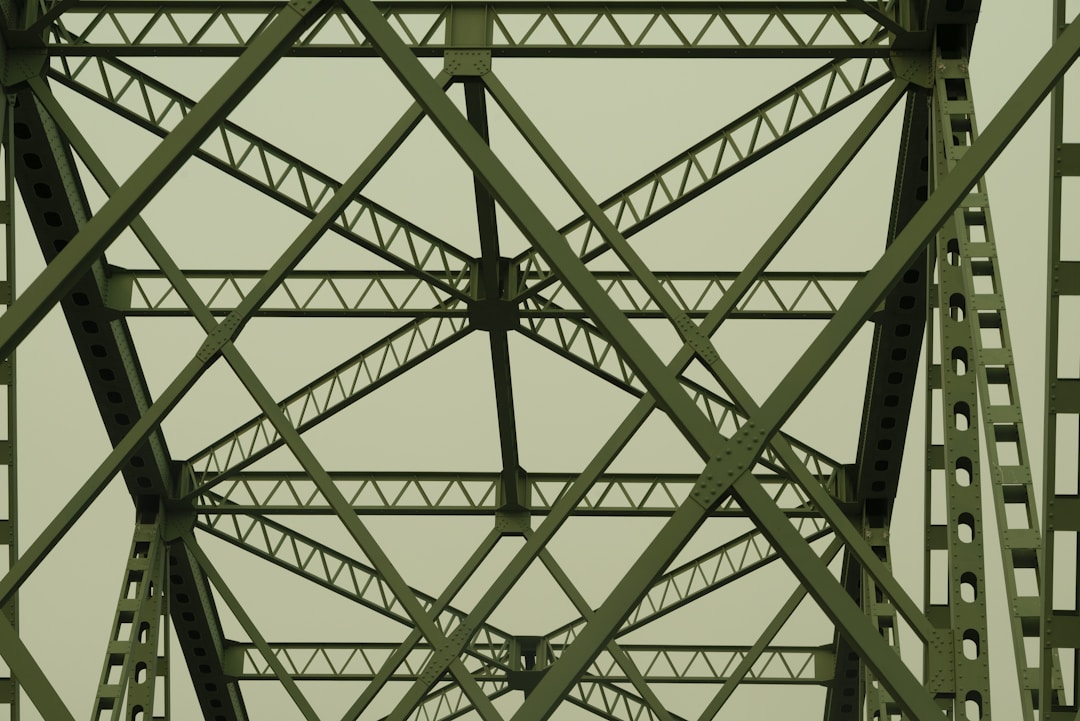 Stone bridge spanning across a deep canyon connecting two cliff edges