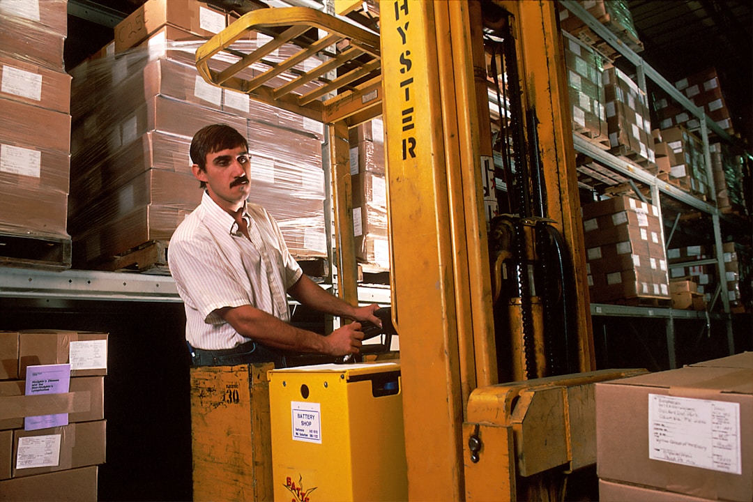 Business owner contemplating strategic decisions in industrial warehouse setting