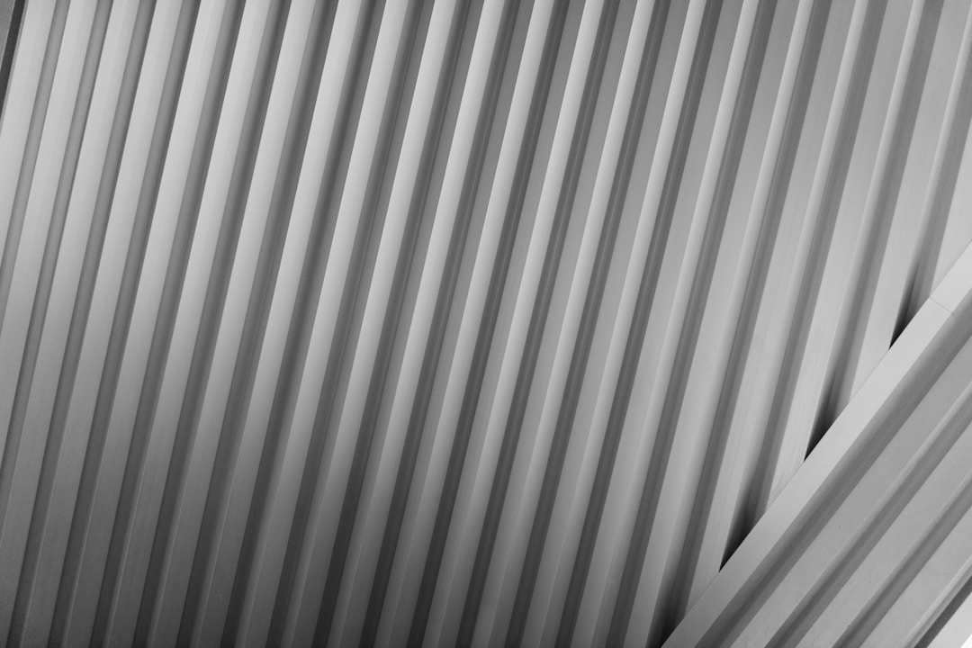 Two professionals in serious discussion reviewing documents across table