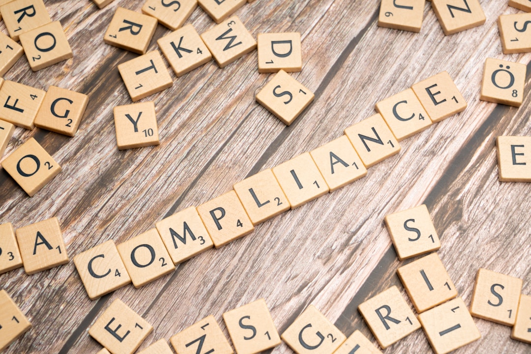 Professional reviewing regulatory compliance framework documents and checklist with methodical approach
