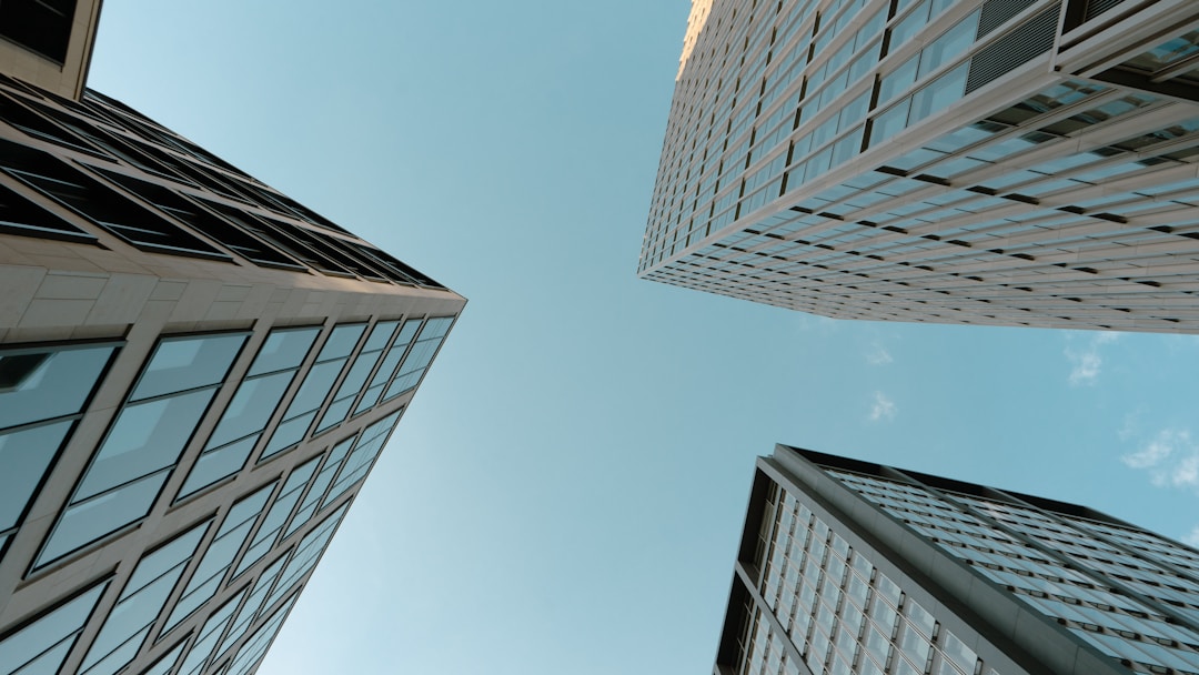 Lighthouse beacon illuminating path through rocky coastline for business guidance