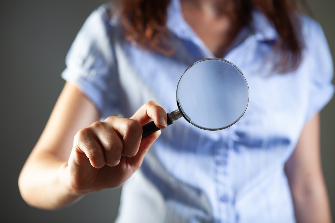 Close-up of magnifying glass revealing hidden details, symbolizing buyer due diligence investigation