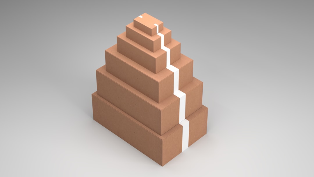 Wooden building blocks arranged in ascending steps forming organizational hierarchy structure