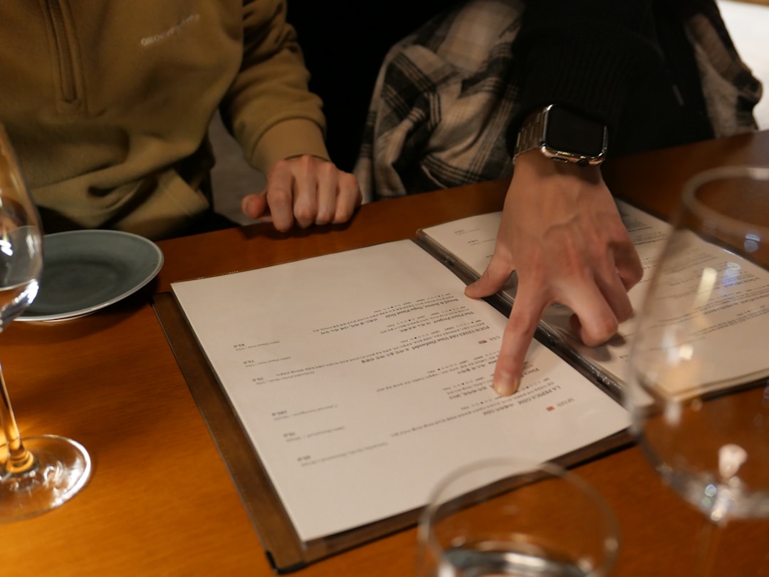Close-up of hands signing important business agreement with pen